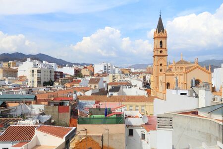 Malaga, Spain. Cityscape with church and residential architecture.の写真素材