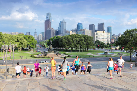 PHILADELPHIA, USA - JUNE 11, 2013: People run down famous Rocky Steps in Philadelphia. The steps were made famous by the film "Rocky" and are known among runners of the world.のeditorial素材