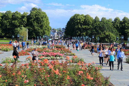 OSLO, NORWAY - AUGUST 2, 2015: People visit gardens and Vigeland Installation in Frogner Park, Oslo. 212 sculptures around the park were all designed by artist Gustav Vigeland.のeditorial素材