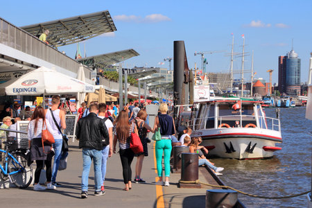 HAMBURG, GERMANY - AUGUST 28, 2014: People visit the port in Hamburg. It is the 15th busiest seaport in the world in terms TEU throughput (2011). It was opened in year 1189.のeditorial素材