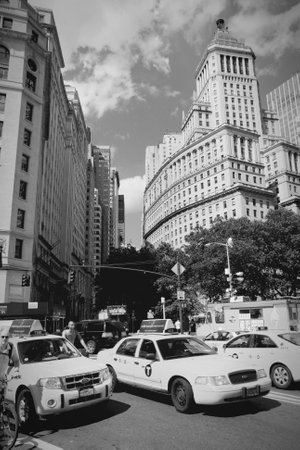 NEW YORK, USA - JULY 4, 2013: People ride taxi cabs in Lower Manhattan in New York. As of 2012 there...
