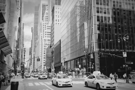 NEW YORK, USA - JULY 4, 2013: People ride yellow taxi cabs along 42nd Street in New York. As of 2012 there were 13,237 yellow taxi cabs registered in New York City.のeditorial素材
