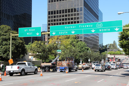 LOS ANGELES, USA - APRIL 5, 2014: People drive cars in downtown LA. Los Angeles is the 2nd most...