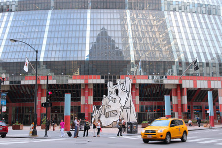 CHICAGO, USA - JUNE 26, 2013: People walk by James R. Thompson Center in Chicago. The modern building houses offices of the Illinois state government.のeditorial素材