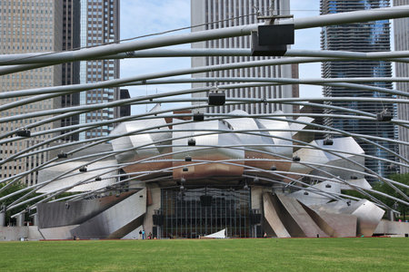 CHICAGO, USA - JUNE 26, 2013: People visit Jay Pritzker Pavilion in Millennium Park in Chicago. Jay Pritzker Pavilion is a famous bandshell designed by Frank Gehry.のeditorial素材