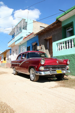 TRINIDAD, CUBA - FEBRUARY 5, 2011: Oldtimer Ford car parked in Trinidad. Cuba has one of the lowest car-per-capita rates (38 per 1000 people in 2008).のeditorial素材