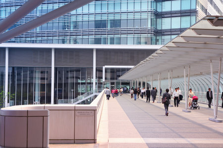 YOKOHAMA, JAPAN - MAY 10, 2012: People walk in modern area of the city in Yokohama, Japan. Yokohama is the 2nd largest city in Japan by population after Tokyo with almost 3.7m people.のeditorial素材