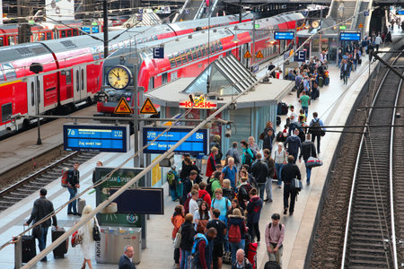 HAMBURG, GERMANY - AUGUST 28, 2014: Travelers board trains at Central Railway Station (Hauptbahnhof) in Hamburg. With 450,000 daily passengers it is the 2nd busies station in Europe.のeditorial素材