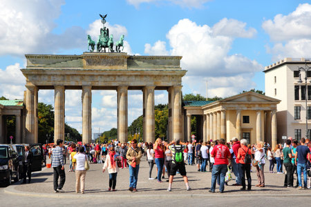 BERLIN, GERMANY - AUGUST 27, 2014: People visit Brandenburg Gate in Berlin. Berlin is Germany's largest city with population of 3.5 million.のeditorial素材