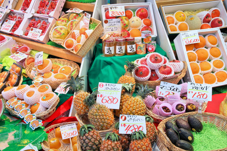 OSAKA, JAPAN - APRIL 25, 2012: Food prices at Nipponbashi Kuromon market in Osaka, Japan. According to Tripadvisor, it is currently among best 3 shopping places in Osaka.のeditorial素材