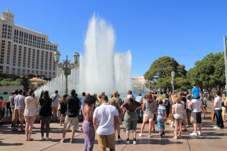 LAS VEGAS, USA - APRIL 14, 2014: People enjoy the fountains in front of Bellagio casino in Las Vegas. Bellagio is among 15 largest hotels in the world with 3,950.のeditorial素材