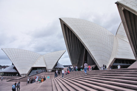 SYDNEY, AUSTRALIA - FEBRUARY 14, 2008: People walk outside the Opera House in Sydney, Australia. The Sydney Opera House is a UNESCO World Heritage Site since 2007.のeditorial素材