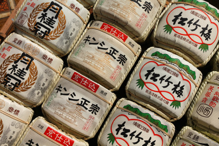 KYOTO, JAPAN - APRIL 19, 2012: Japanese rice wine (nihonshu) barrels in Kyoto, Japan. Kazaridaru sake barrel decorations are typical for shinto shrines in Japan.のeditorial素材