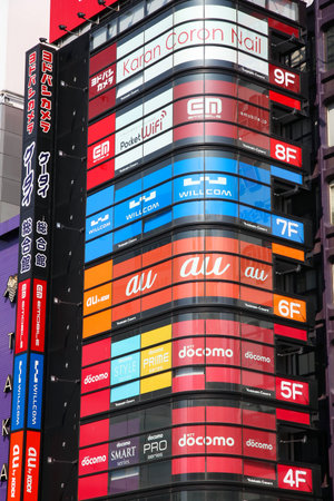 TOKYO, JAPAN - MAY 11, 2012: Colorful advertisements in Shinjuku district, Tokyo. Shinjuku is one of the busiest districts of Tokyo, with many international corporate headquarters located here.のeditorial素材