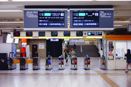 OSAKA, JAPAN - APRIL 26, 2012: Passengers walk in Osaka Namba train station in Osaka, Japan. Osaka Namba exists since 1970 and was used by average 150,000 passengers daily in 2010.のeditorial素材