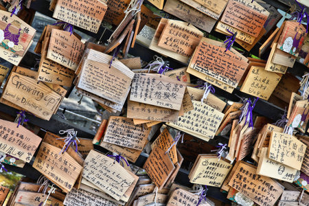 TOKYO, JAPAN - APRIL 12, 2012: Ema, traditional wooden prayer boards in front of Ueno Toshogu Shrine in Taito ward of Tokyo. Kami (the spirits of gods) receive the wishes.のeditorial素材