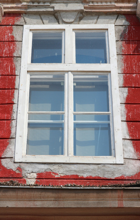 Window in Timisoara - city in Banat region of Romania. Timis county. Old residential architecture detail.の写真素材
