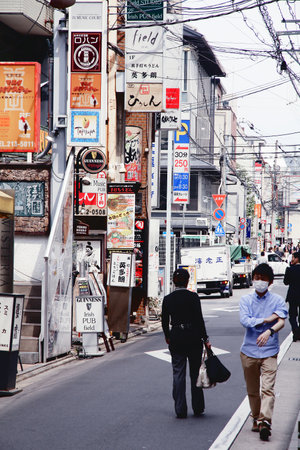 KYOTO, JAPAN - APRIL 19, 2012: People walk in downtown Kyoto, Japan. Kyoto is the former imperial capital of Japan, now it's a major city with 1.5 million population.のeditorial素材