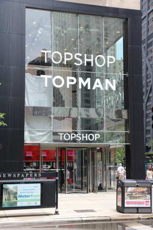 CHICAGO, USA - JUNE 26, 2013: People walk by Topshop Topman store at Magnificent Mile in Chicago. The Magnificent Mile is one of most prestigious shopping districts in the United States.のeditorial素材