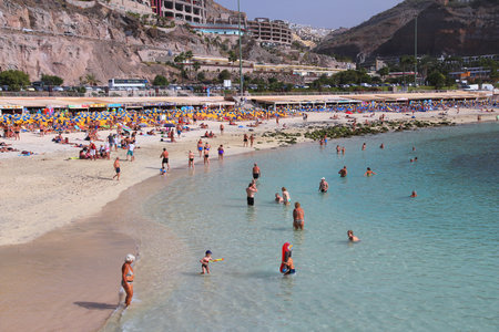 GRAN CANARIA, SPAIN - DECEMBER 4, 2015: People visit Amadores Beach in Gran Canaria, Spain. Canary Islands had record 12.9 million visitors in 2014.のeditorial素材