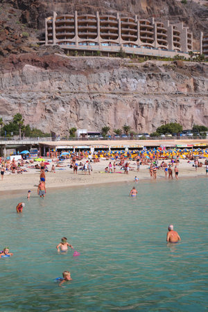 GRAN CANARIA, SPAIN - DECEMBER 4, 2015: People visit Amadores Beach in Gran Canaria, Spain. Canary Islands had record 12.9 million visitors in 2014.のeditorial素材