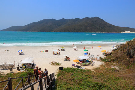 CABO FRIO, BRAZIL - OCTOBER 17, 2014: People visit Cabo Frio Prainhas beach in state of Rio de Janeiro in Brazil. Brazil had 5.17 million visitors in 2012.のeditorial素材