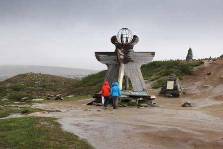 ARCTIC CIRCLE, NORWAY - JULY 30, 2015: People visit statue at Arctic Circle, Norway. Foreign tourists spent some 5 million overnight stays in Norway in 2013.のeditorial素材