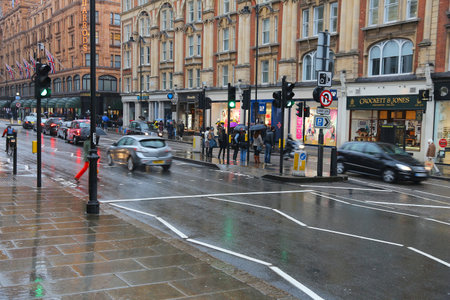 LONDON, UK - APRIL 22, 2016: People shop at Brompton Road in Knightsbridge, London, UK. London is the most populous city in the UK with 13 million people living in its metro area.のeditorial素材