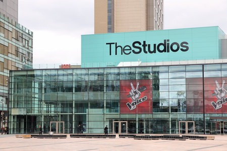 MANCHESTER, UK - APRIL 22, 2013: People visit Studios MediaCityUK in Manchester, UK. MediaCityUK is a 200-acre development completed in 2011, used by BBC, ITV and other companies.のeditorial素材