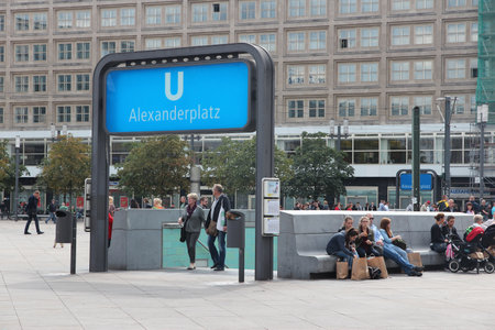 BERLIN, GERMANY - AUGUST 26, 2014: People visit the Alexander Square (Alexanderplatz) in Berlin. Berlin is Germany's largest city with population of 3.5 million.のeditorial素材