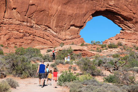 UTAH, UNITED STATES - JUNE 21, 2013: Tourists visit Windows Arch in Arches National Park in Utah. Arches NP was visited by 1,070,577 people in 2012.のeditorial素材