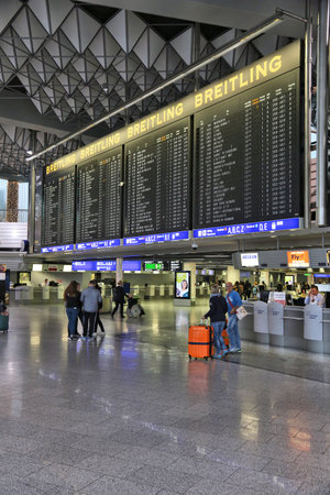 FRANKFURT, GERMANY - DECEMBER 6, 2016: Passengers visit Terminal 1 of Frankfurt International Airport in Germany. It is the 12th busiest airport in the world with 61 million passengers in 2015.のeditorial素材