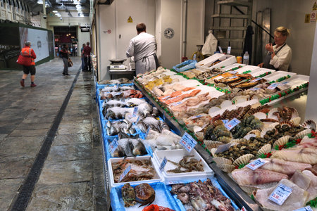LEEDS, UK - JULY 11, 2016: People visit Leeds Kirkgate Market in the UK. There are 800 stalls in the market. It is visited by 100,000 weekly shoppers.のeditorial素材