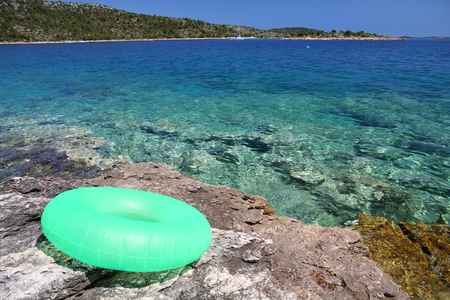 Croatia nature - Adriatic Sea landscape in Murter Island. Inflatable swimming ring.の写真素材