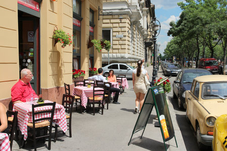 BUDAPEST, HUNGARY - JUNE 19, 2014: People sit at restaurant by Andrassy Avenue in Budapest. 3.3 million people live in Budapest Metropolitan Area.のeditorial素材