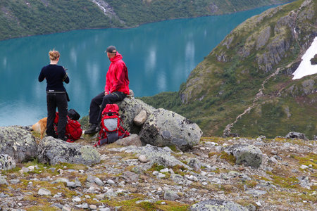 JOTUNHEIMEN, NORWAY - AUGUST 1, 2015: People rest at Besseggen trail in Jotunheimen National Park, Norway. Norway had almost 5 million foreign visitors in 2011.のeditorial素材
