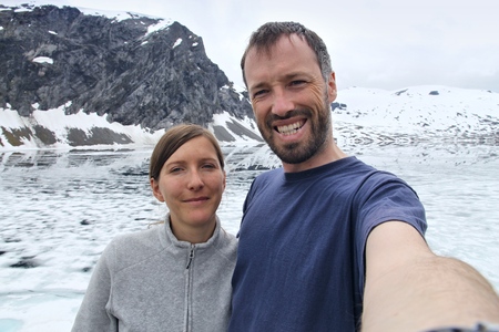 Couple selfie in Norway - hiking vacation view with Djupvatnet lake in Geiranger-Herdalen Landscape Park.の写真素材
