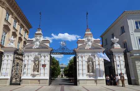 WARSAW, POLAND - JUNE 19, 2016: People walk by University of Warsaw in Poland. The public university was established in 1816 and has more than 50 thousand students.のeditorial素材