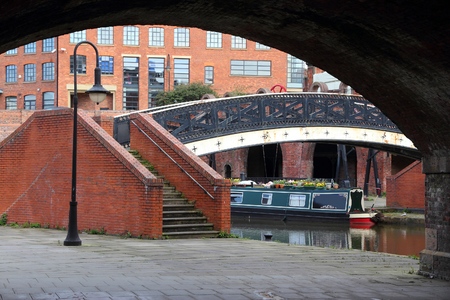 Manchester, UK. Castlefield district, waterway canal area with a narrowboat.