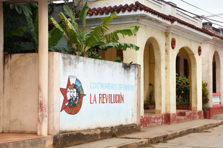 BARACOA, CUBA - FEBRUARY 13, 2011: Wall mural celebrates Revolution and Socialism in Baracoa, Cuba. Cuban Revolution brought famous Fidel Castro to power in 1953.のeditorial素材
