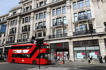 LONDON, UK - JULY 7, 2016: People shop at Regent Street in London. Regent Street is a major shopping street in West End of London.のeditorial素材