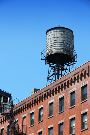 New York water tower - typical wooden water container in SoHo.のeditorial素材