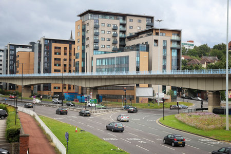 SHEFFIELD, UK - JULY 10, 2016: People drive on a multi-lane street in Sheffield, UK. United Kingdom has 519 vehicles per 1000 inhabitants.のeditorial素材