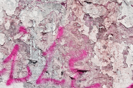Grunge pink concrete wall background - urban decay texture with peeling paint.の写真素材