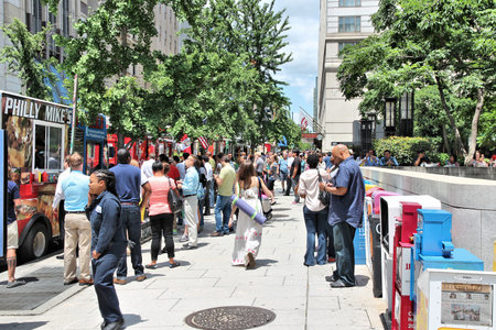 WASHINGTON, USA - JUNE 14, 2013: People buy food from the trucks in Washington DC. 646 thousand...