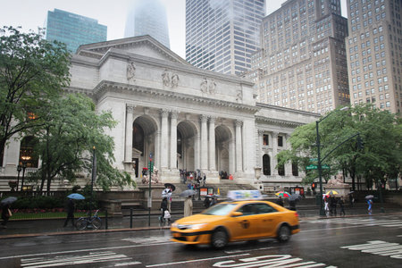 NEW YORK, USA - JUNE 7, 2013: People walk by the New York Public Library. Almost 19 million people live in New York City metropolitan area.のeditorial素材