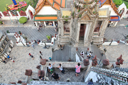 BANGKOK, THAILAND - DECEMBER 7, 2013: Tourists visit Wat Arun temple in Bangkok. 26.7 million people visited Thailand in 2013.のeditorial素材