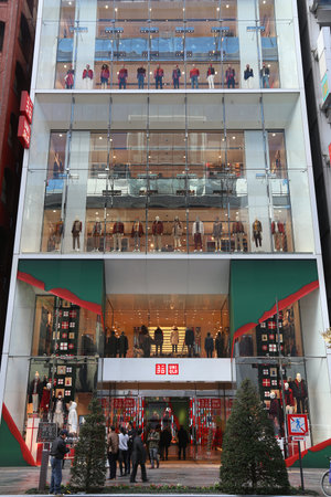 TOKYO, JAPAN - DECEMBER 1, 2016: People shop in Uniqlo at Ginza district of Tokyo, Japan. Ginza is a legendary shopping area in Chuo Ward of Tokyo.のeditorial素材