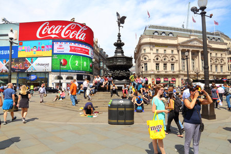 LONDON, UK - JULY 7, 2016: People visit Piccadilly Circus in London. London is the most populous city in the UK with 13 million people living in its metro area.のeditorial素材