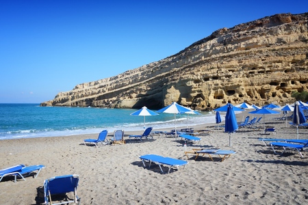 Matala, Crete - beach view with hippie caves in background.の写真素材